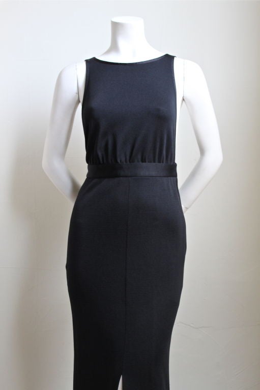 Very sexy fitted jet black dress from Yves Saint Laurent. Ca. 1985. French size 36. Best suited for a US 2 (24
