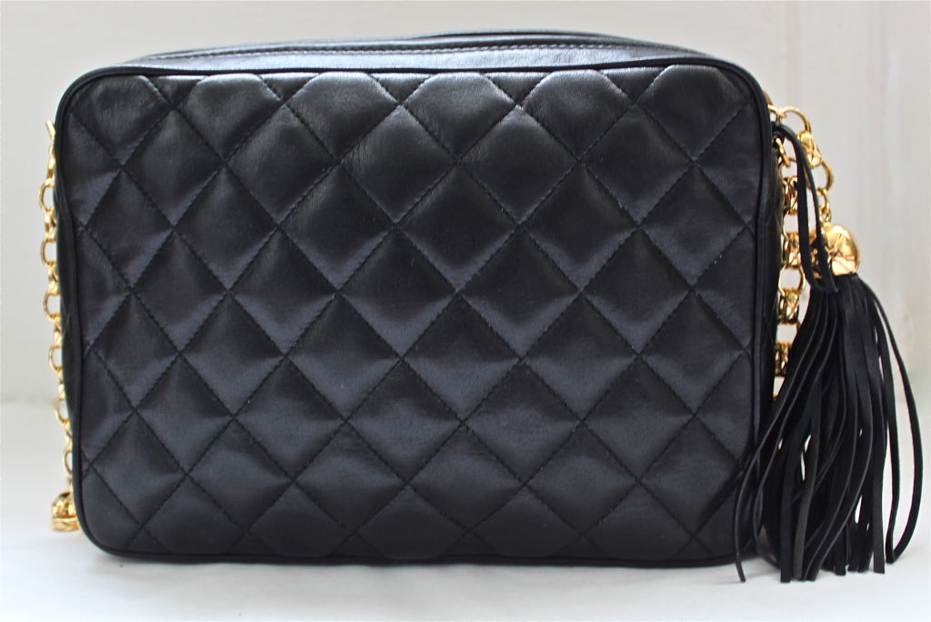 CHANEL black leather flap bag with turn lock