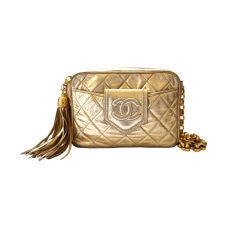 1980's CHANEL gold quilted leather bag with tassel