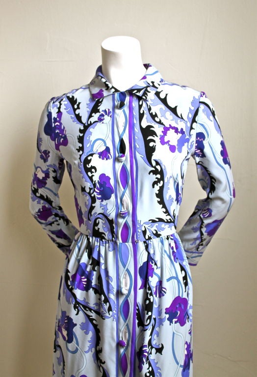 Classic EMILIO PUCCI floral printed silk dress dating to the 1960's. Beautiful color scheme of blues and purples with black accents. Snap closure at front. Fits a US 2. Bust measures approximately 34