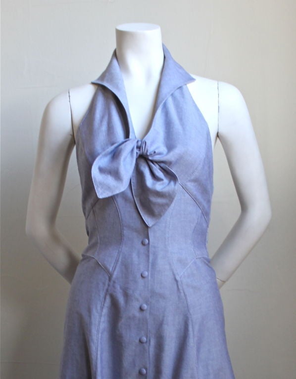 Dress made of blue oxford cloth with halter and tie front from Thierry Mugler dating to the 1990's. Fits a US 4 or 6. Snaps up front with self covered snaps. Made in France. Excellent condition.