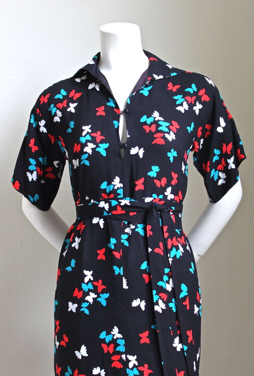 Beautiful black dress with butterfly motif from Yves Saint Laurent rive gauche dating to the 1980's. Size 34, best suited for a US 2. Fully lined. Made in France. Very good condition.