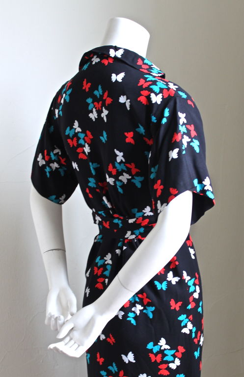 Women's YVES SAINT LAURENT butterfly print dress with long belt.