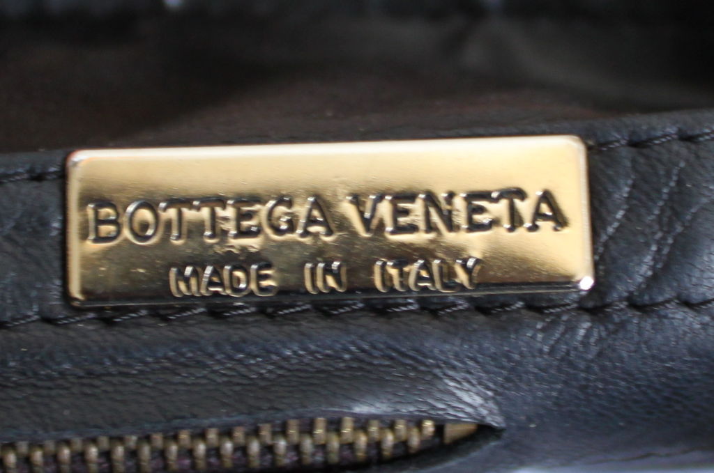 Black woven leather and fabric bag from Bottega Veneta dating to the late 1980's. Bag measures about 10