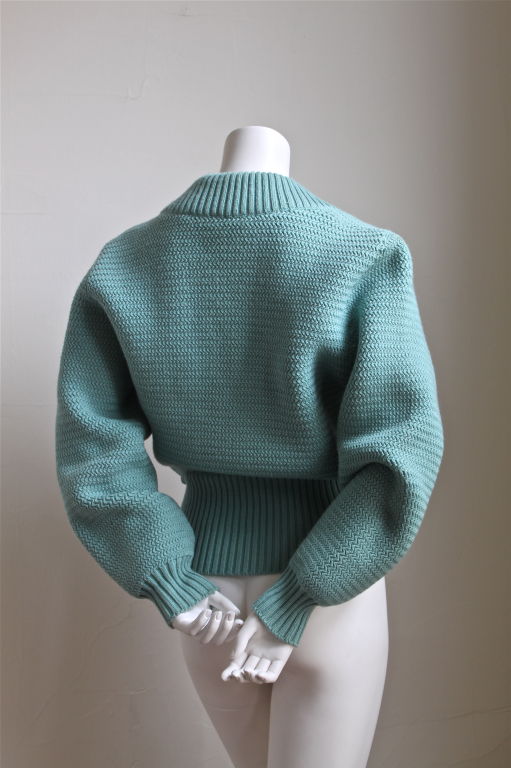 Very thickly knit light-turquoise wool sweater jacket from Azzedine Alaia dating to the 1980s. Size 'S'. Brass zipper closure and zippered pockets. Made in Italy. Excellent condition.