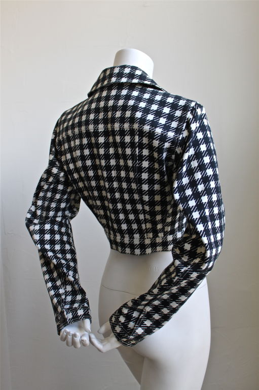 Very rare black and white houndstooth jacket from Azzedine Alaia'a 'Tati' collection dating to the 1990's. Labeled a French size 38, which is best suited for a US 2 or 4. Approximate measurements are  Bust 35-36