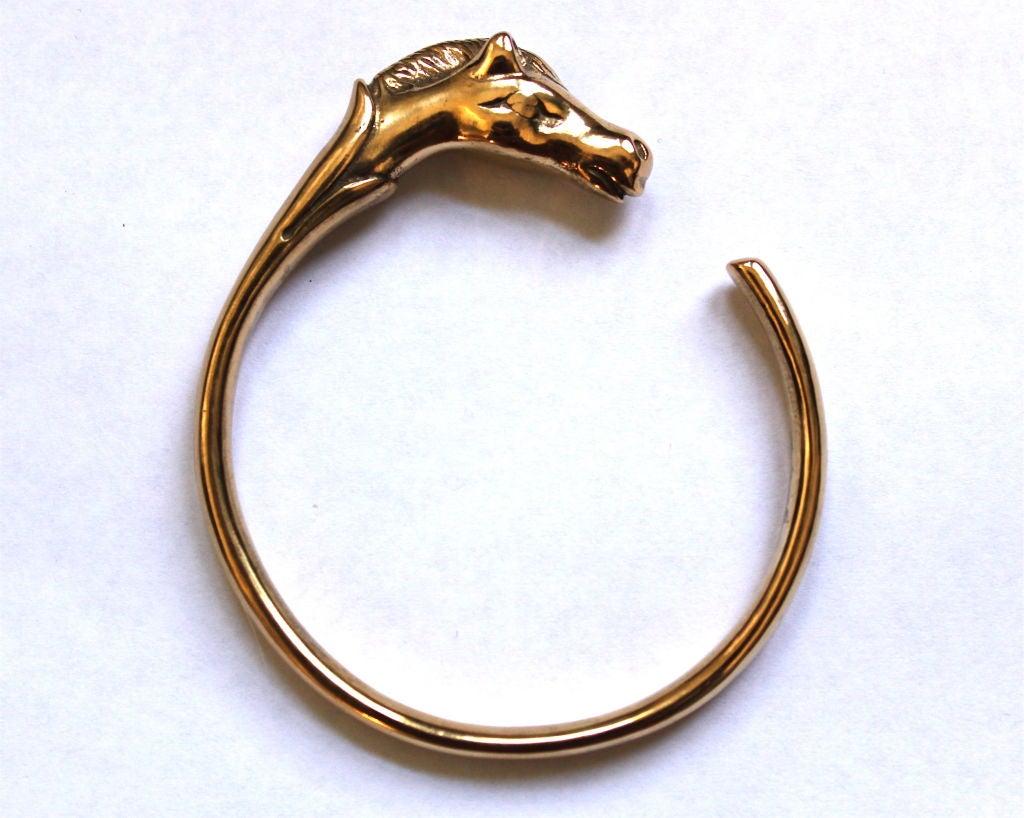 Women's HERMES gilt horse bangle bracelet