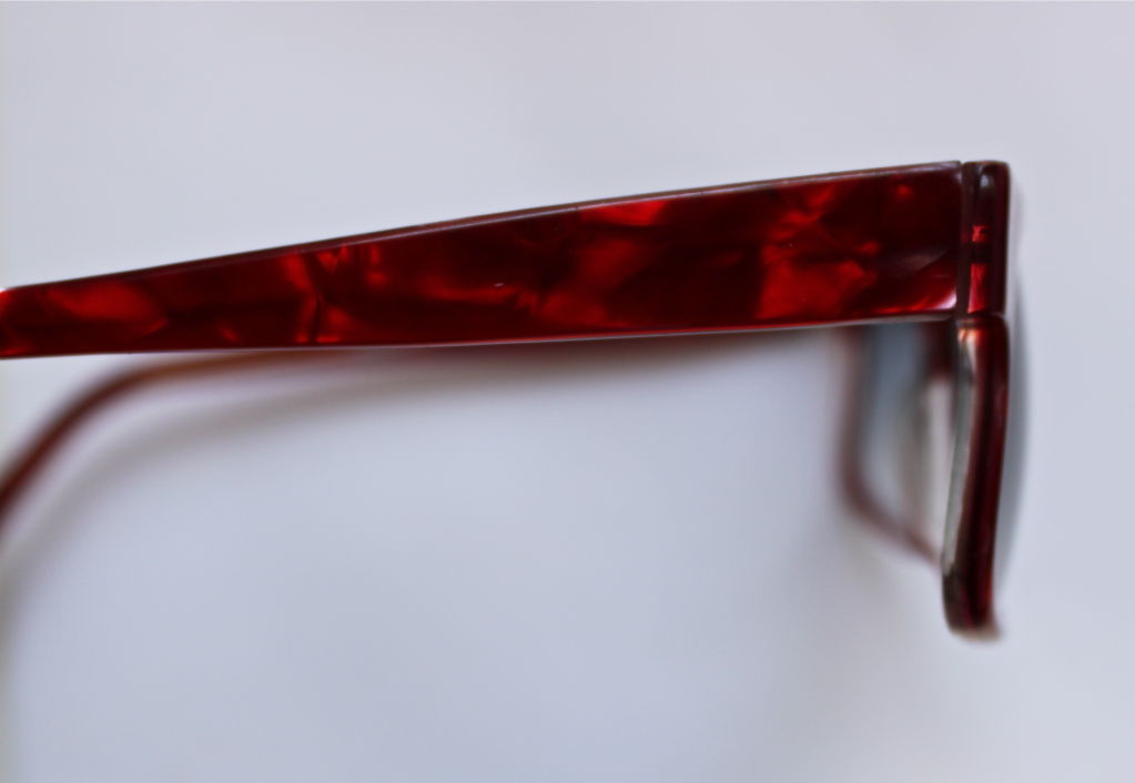 Avant garde shaped plastic red shell sunglasses from Anne Marie Perris dating to the 1980's. Unworn. Sunglasses fit a medium width face. Measure approximately 5.5