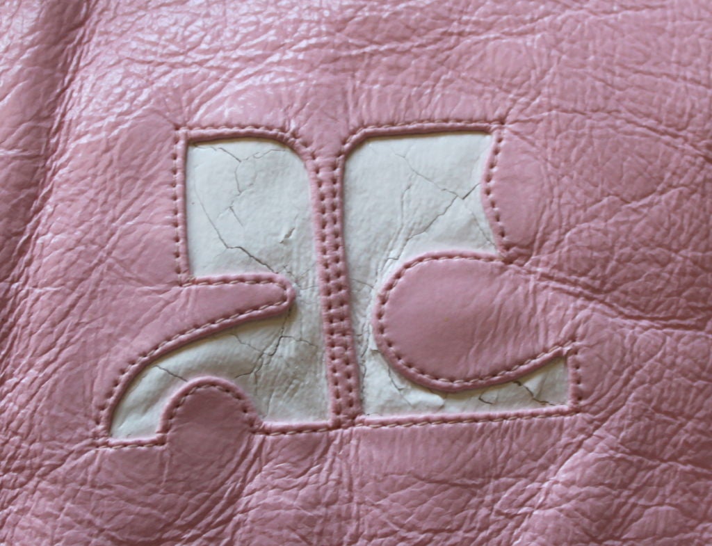 Pink mod vinyl jacket from Courreges dating to the 1990's.  Labeled a French size 42, which fits a US 6-8. Measures approximately 38
