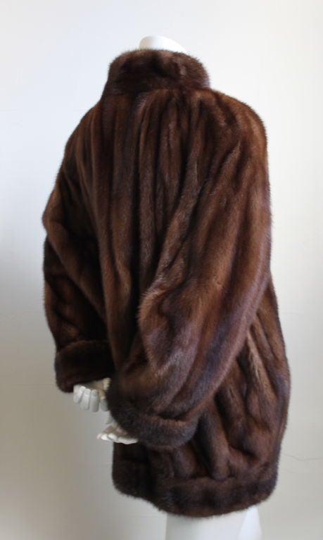 Incredibly rare, haute couture Russian sable mink fur coat with horn buttons From Yves Saint Laurent. The details are unbelievable!!! This fur has everything you'd expect from a haute couture garment. Approximate measurements are as follows: bust