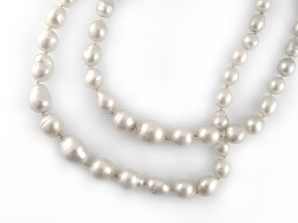 Composed of 33 and 30 baroque pearls in silver and rose overtones, graduating in size from approx. 8 - 13mm, lengths - 15
