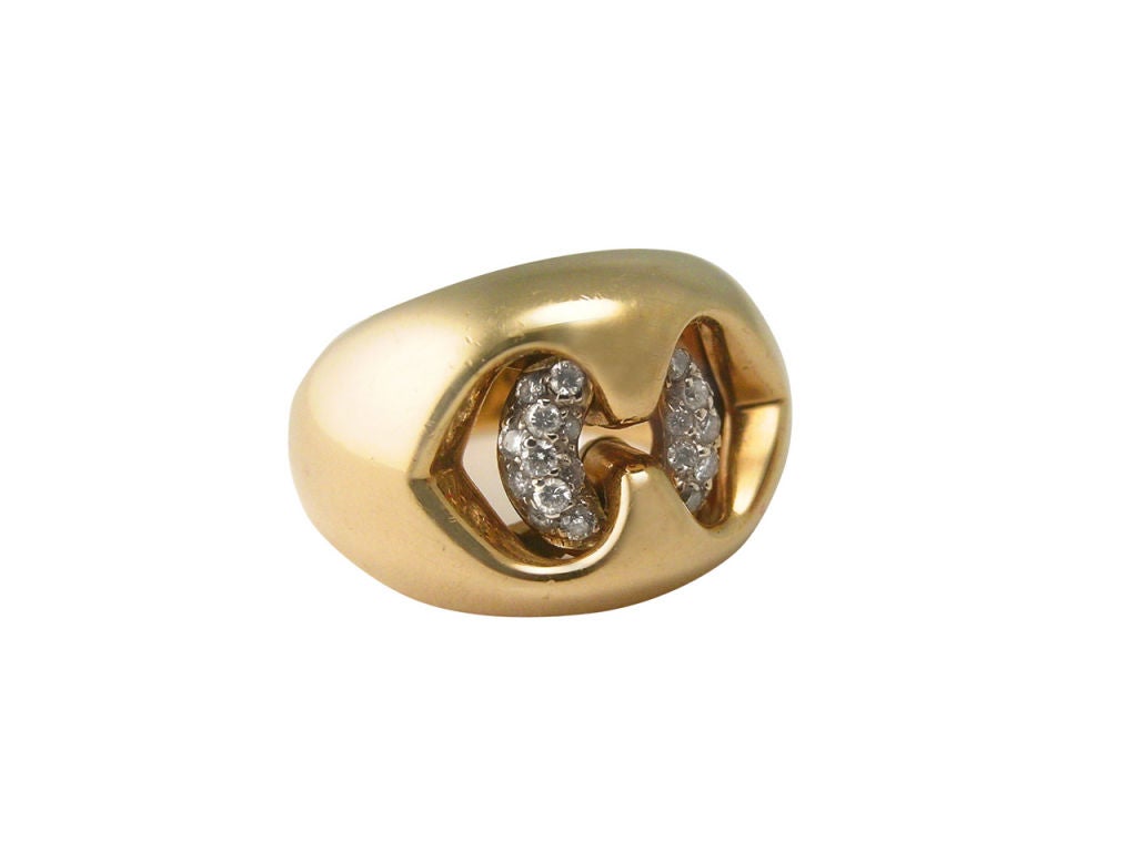 18kt gold and diamond satin finish ring with pave' diamonds. Signed BULGARI, 750, and numbered. Pouch included. Size 5-1/2.