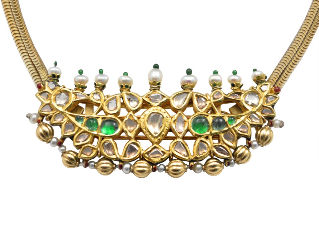 18 kt. gold necklace centering a rose-cut diamond, ,emerald, and pearl plaque that detaches as a large clip. Signed CARTIER PARIS 12573, with French marks and assay marks.