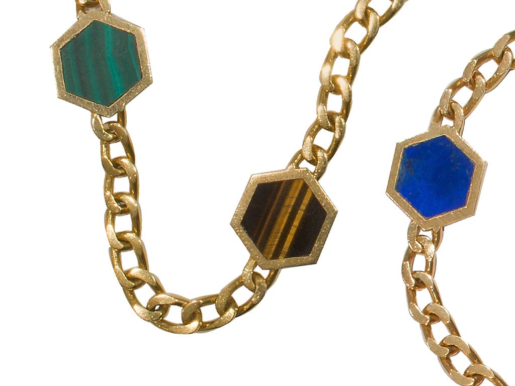 18 kt gold neck chain set with hexagonal hard stone plaques, circa 1970, 35 inches in length. Signed BVLGARI, N.Y. 18 K.