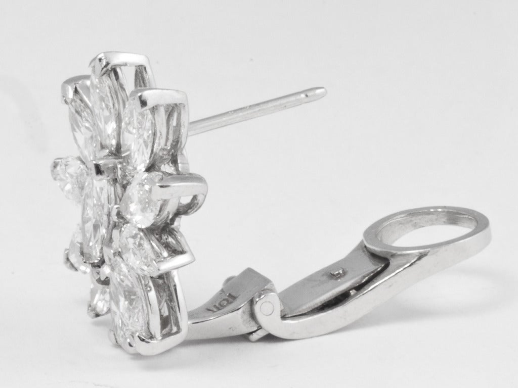 Platinum earclips set with 22 marquis diamonds, totaling approximately 6.00 carats. Diamonds are approximately H color - Vs clarity. With Clips and posts.