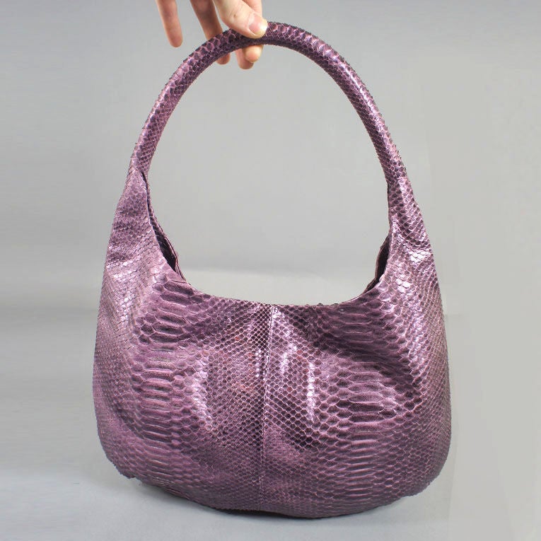 Devi Kroell rare cyclamen python medium hobo handbag. Classic hobo bag silhouette in exotic purple-pink skin color with magnetic closure. Inside zipper pocket with matching python pull and open pocket on opposite side in python.  This exotic handbag