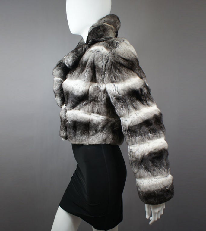 Maximilian luxe black, white, and grey chinchilla fur cropped jacket. Originally purchased at Bloomingdale’s. This über-soft exotic chinchilla jacket features a notch collar, front hook-and-loop closure and black silk lining. This piece is striking