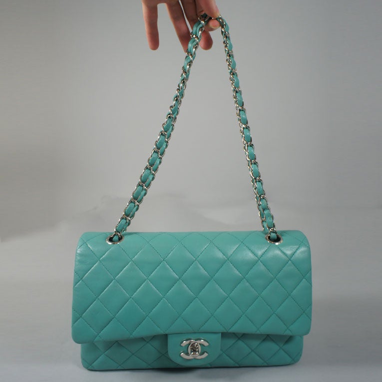 CHANEL classic 2.55 double flap bag in aqua green with silver tone hardware. This bag is a beautiful, rare color that cannot be found anywhere else. Perfect for spring and summer, this Chanel forever favorite is sure to be the talk of the town. This