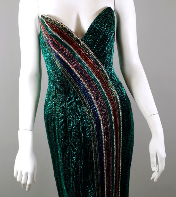 Bob Mackie ornately beaded 1980s vintage emerald green strapless evening gown with red and purple striping & crystal detail. This stunning gown is signature Mackie in every way. The 