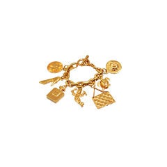 CHANEL 1960s Antique Gold-Tone 7-Icon Charm Bracelet