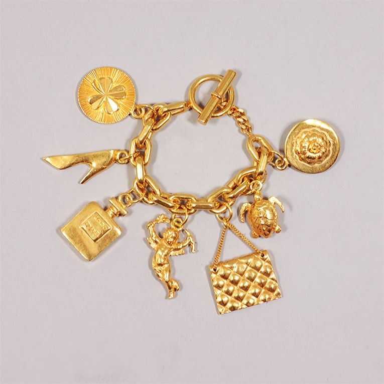 CHANEL 1960s Vintage Gold-Tone 7-Icon Charm Bracelet
