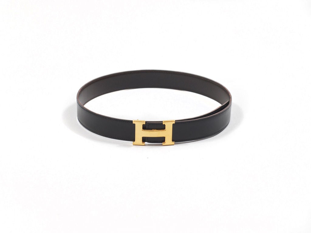 Hermes noir reversible box leather Constance belt GHW. Black on one side; chocolate on the other. Perfect Hermes basic to wear with any wardrobe. Comes in Hermes box. Buckle is stamped HERMES, belt is stamped Hermes Paris Made in France with maker's