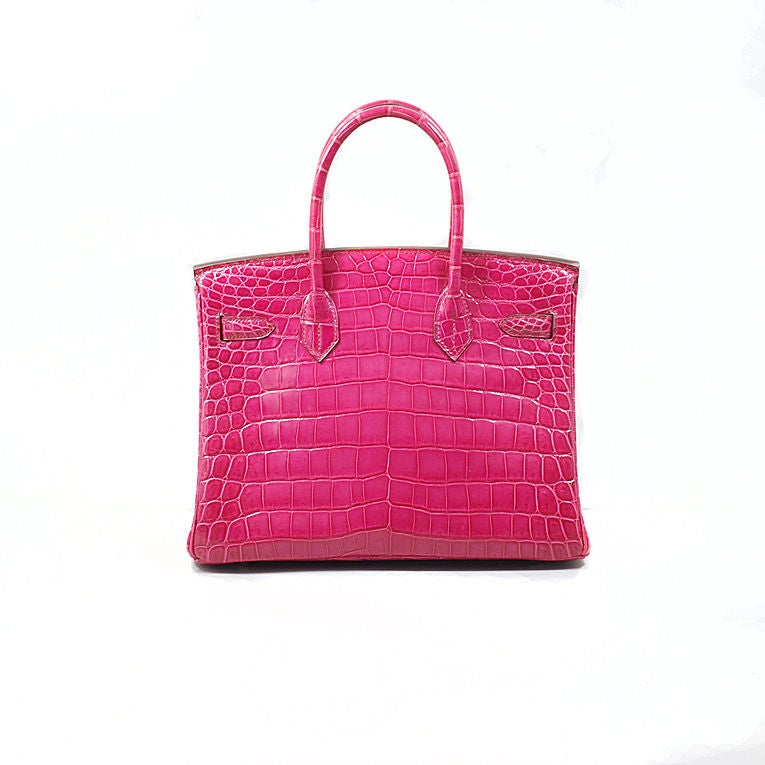 Hermes fuchsia crocodile 30 cm Birkin PHW. This exotic Hermes would be the perfect basic start of a collection or enhance any collection. The bag is pristine & beautiful, blindstamp K in a square (2007). Interior is lined in chevre (goatskin)