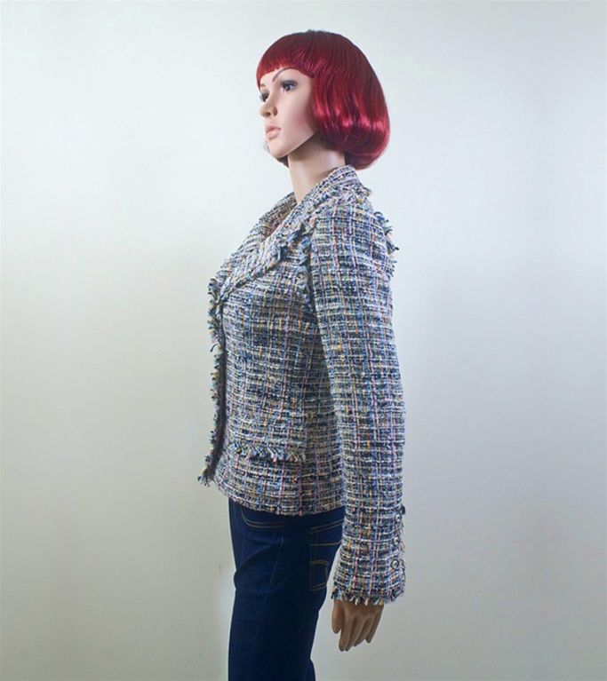 CHANEL multicolor - navy, light pink, orange, light blue, green, and white - fantasy tweed boucle jacket with fringe trim in size FR 36 US 4 from the 04P collection.  The jacket has a notched collar with lapel with fringe trim, three front button