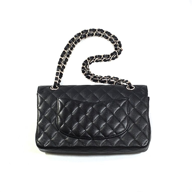 CHANEL classic 10-inch double flap bag 2.55 handbag in black caviar quilted leather with silver hardware. The bag has a front flap with the classic CC turnkey lock; the back has a half moon slip pocket. The braided leather and chain strap can be
