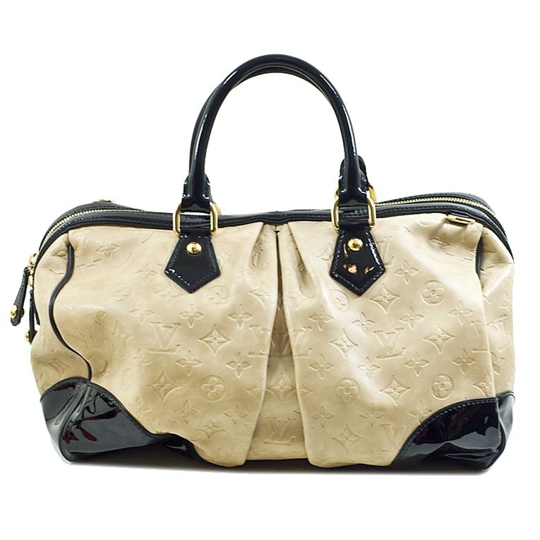 Louis Vuitton ivory Stephen monogram embossed cuir bag with gold-toned hardware.  This limited edition bag was designed by Stephen Sprouse for the 2006 runway, and features embossed monogram leather all around the body of the bag, with the corners,