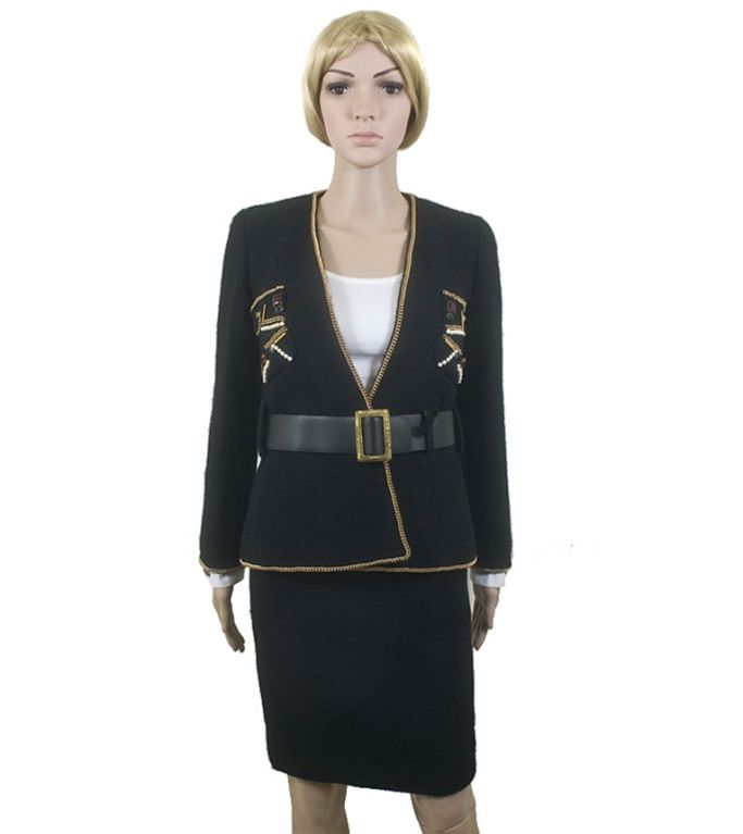 Chanel black boucle skirt suit with gold-tone chain trim and pearl and gripoix jewel accents from the coveted Moscow collection of 09A. This exquisite skirt suit has an open front on the jacket with a gold-tone chain around all hems and the breast