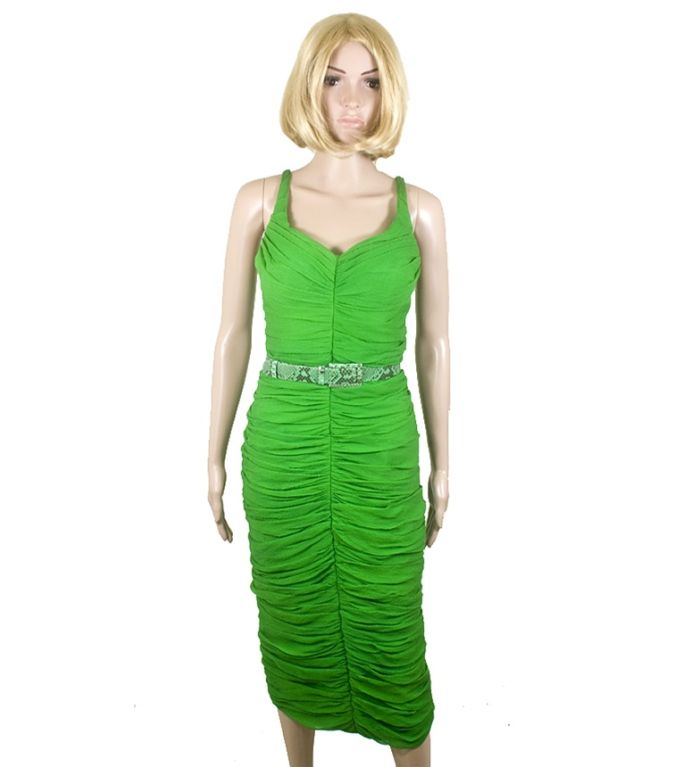 Stand out wherever you go in this stunning green Alexander McQueen dress. Designed to be eye-catching and form-fitting, it has front and back center seams, hidden boning, a décolletage neckline, a back slit, and a detachable snakeskin belt. The