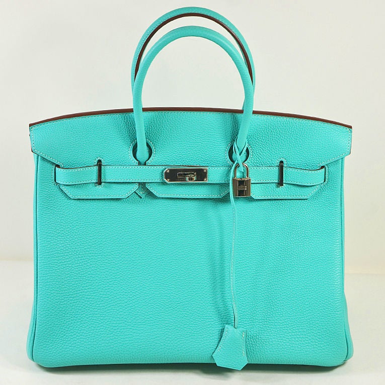 Hermes Lagoon (aqua) Togo leather Birkin handbag in 35cm style model with palladium hardware, matching strap and clochette.<br />
<br />
Interior is lined in chevre (goatskin) leather, and features a side pocket and a side back zipper pocket<br