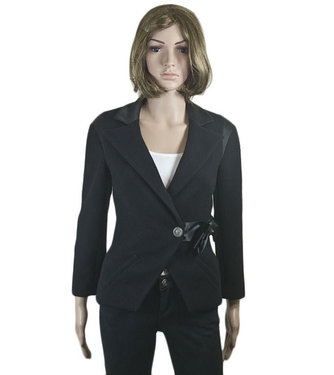 Chanel 08A wool-blend jacket with silk insets at collar and shoulders.  Bracelet length sleeves, a notched lapel collar, and a silk bow at the waist make this formal tailored jacket elegant, sophisticated, and ultra-feminine.<br />
<br />
Chanel