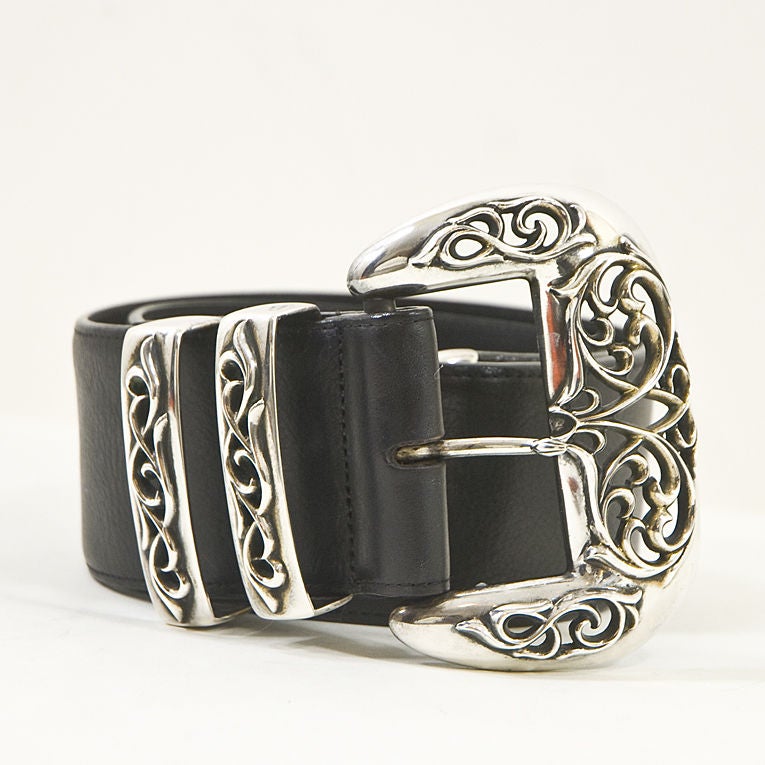 Rare Chrome Hearts belt as seen on rockers from the Rolling Stones to Britney Spears! A large sterling silver buckle is accented by two sterling belt loops and a sterling tip. The wide black leather belt makes this a cool and luxurious addition to