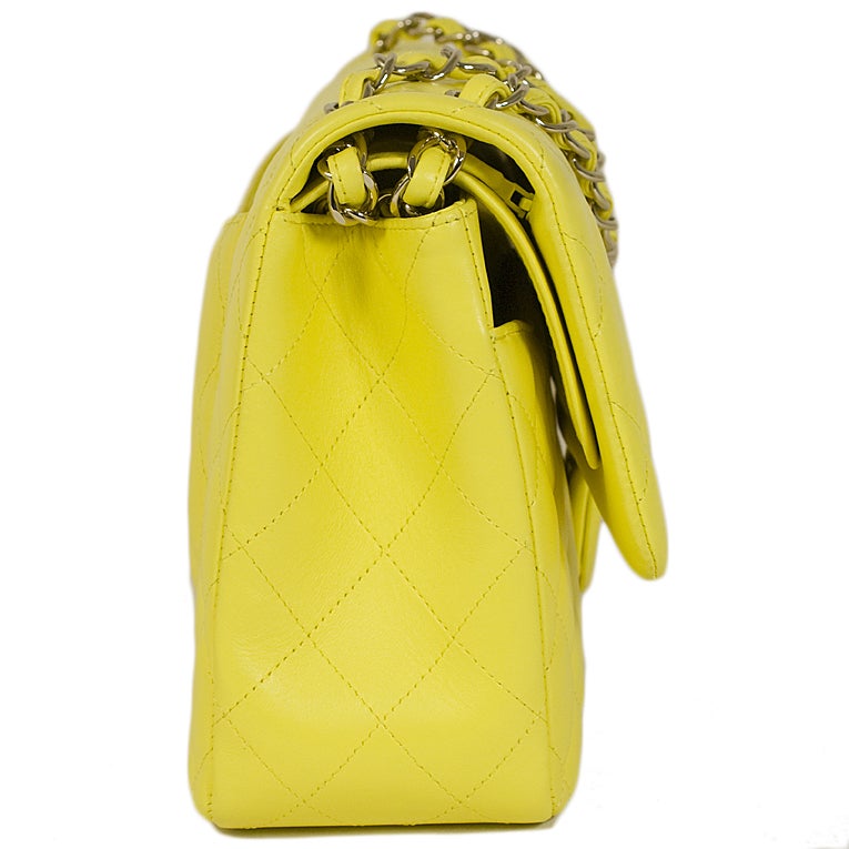 Chanel new limited edition (rare) classic jumbo 2.55 double flap handbag in lambskin bold yellow (juane) with light gold-tone hardware from the 15-series.

Sold out, limited run color.

This Chanel forever favorite features a CC turnkey lock on