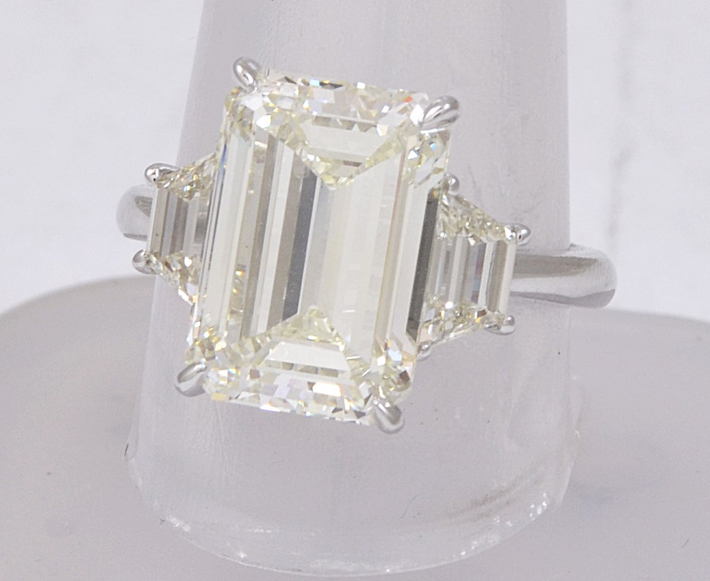Impressive 6.38 Emerald cut with Huge Dimensions set with Two side Trapezoids Beautiful Cut 13.16x9.05 Color Possibly S-T