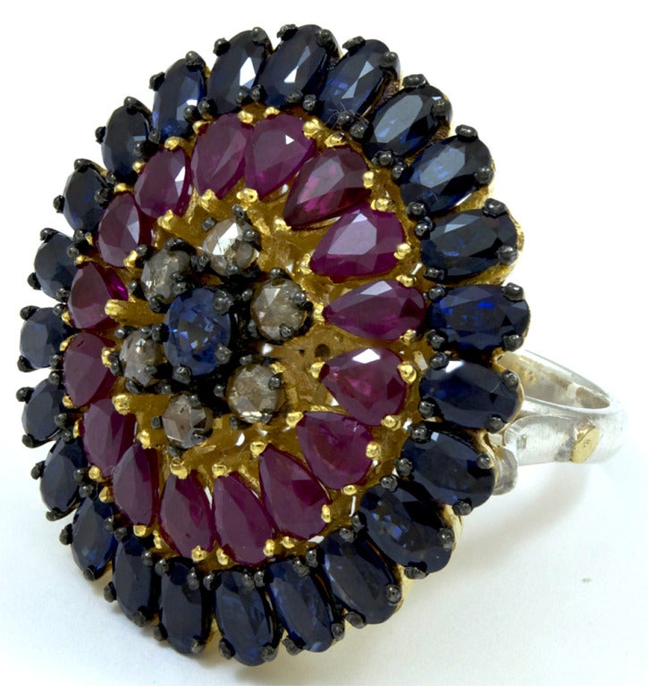Pinwheel Ruby, Sapphire and Diamond Ring

13.26 Color 
.63 Diamonds