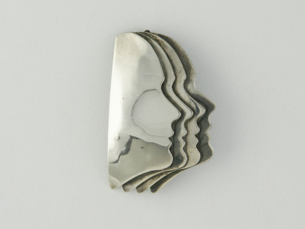 Mario Ceroli four faces silver brooch/pendant.