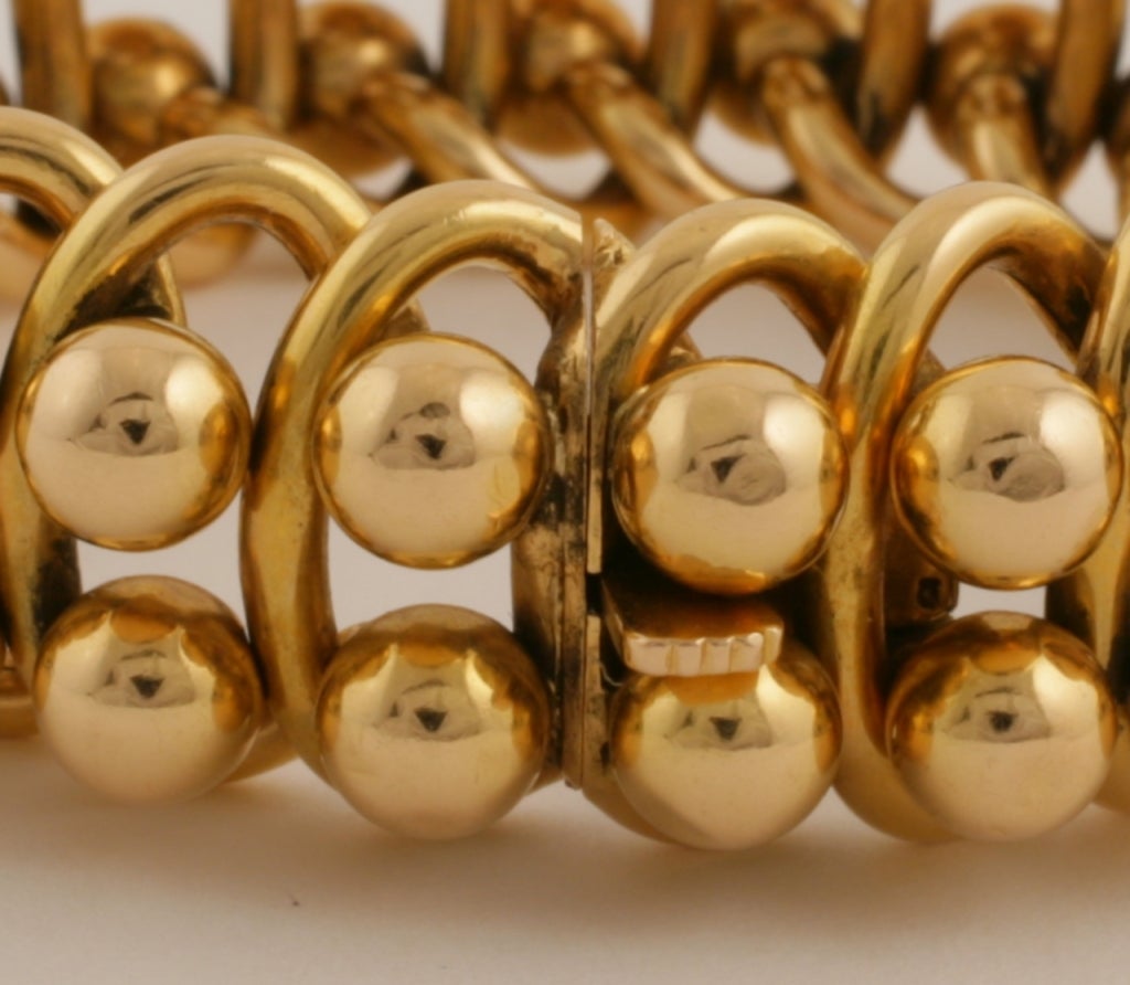 A French Retro 18 karat gold link bracelet with alternating oval links with balls. 

Circa 1940’s. 

Signed, Yendis Paris French control mark  and makers mark. 

(MG #13130)