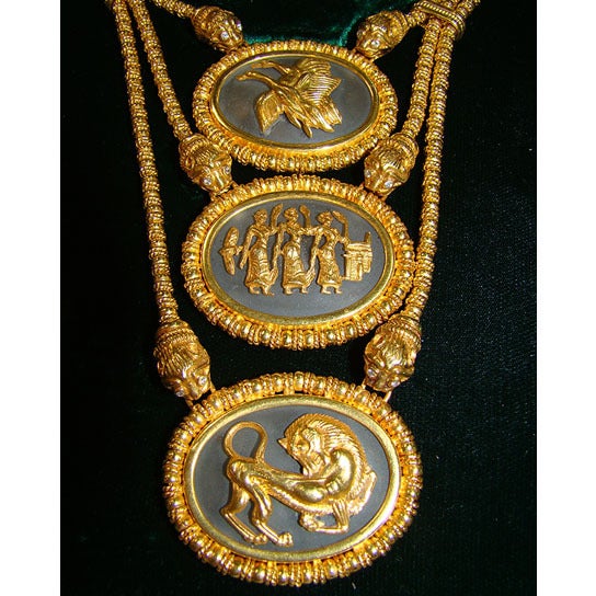 Rare 1960â??s 18K gold Lalaounis necklace with triple chain and triple medallions backed by rock crystal.