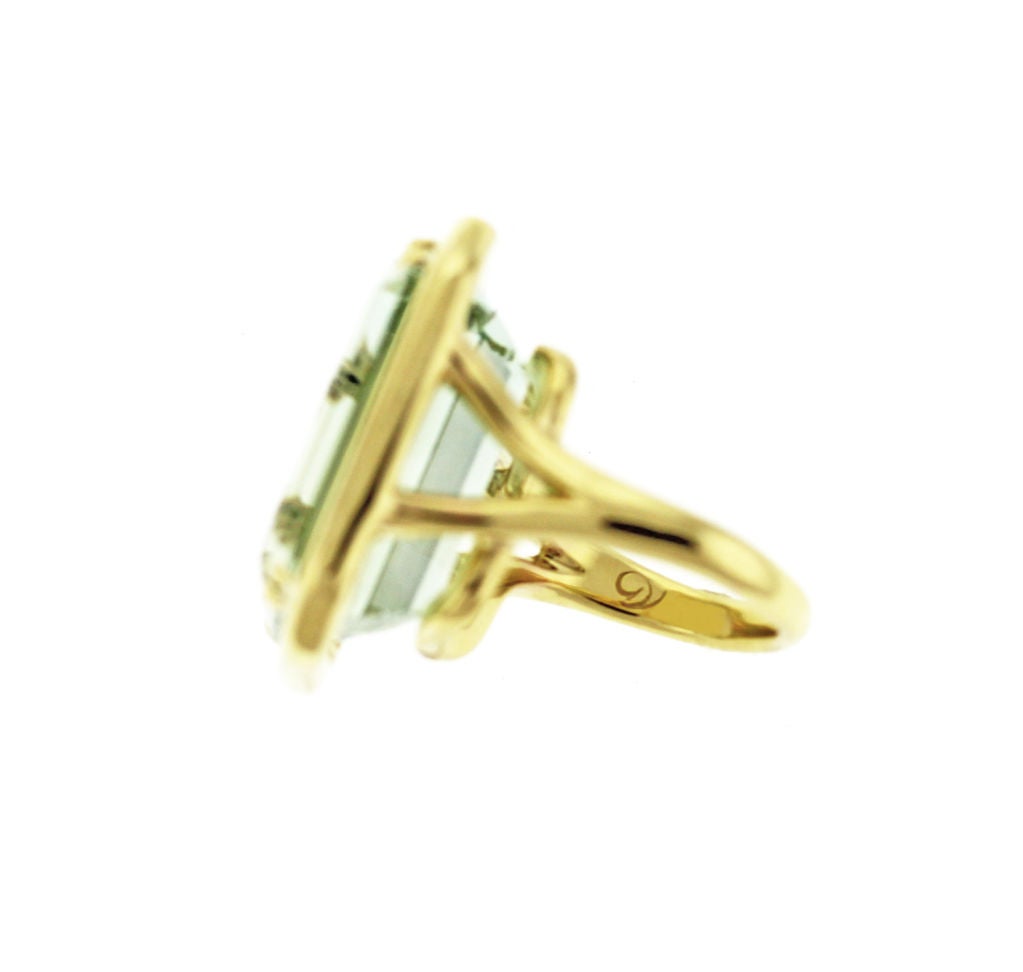 22.67 Carats of Exceptional Green Beryl set in a Custom 18K Yellow Gold Mounting.