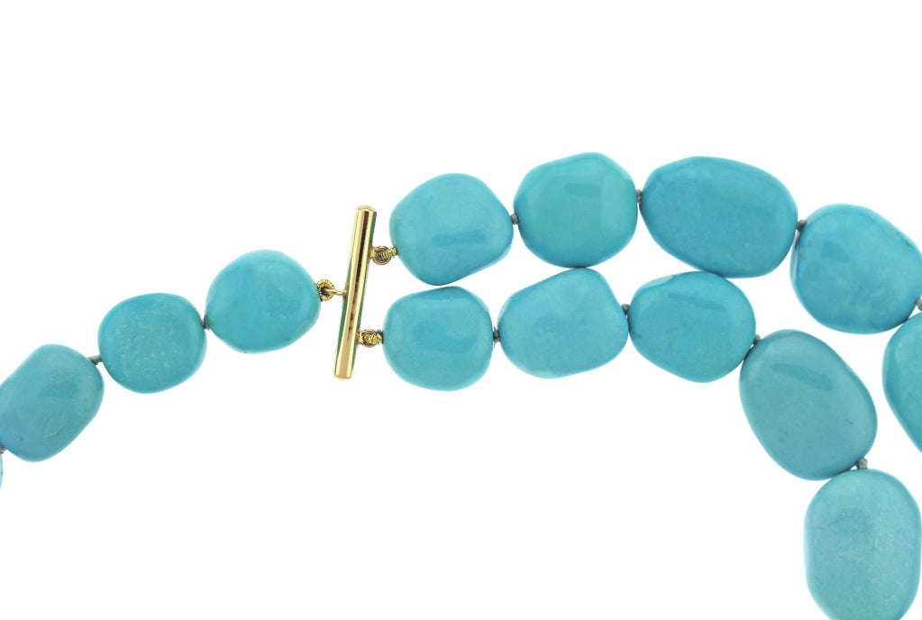 Rich polished Turquoise beads graduated from a front double row to a toggle clasp makes the perfect 