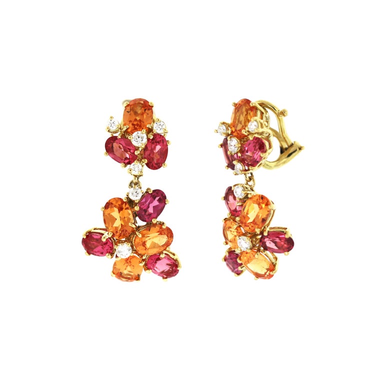Vibrant, vivid mandarin garnets and fuchsia spinels are set with interspersed diamonds in 18KY gold clips.  Available in posts with clips and posts alone. 1 1/4