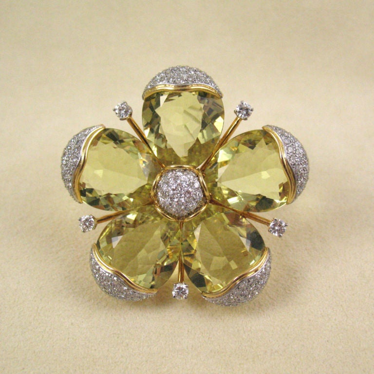 Designed as a flower, the 5 petals as pear-shaped citrines for circa 80 carats with diamond borders and centre, accented by 5 round diamond details in between the petals, mounted in 18k yellow gold, signed 