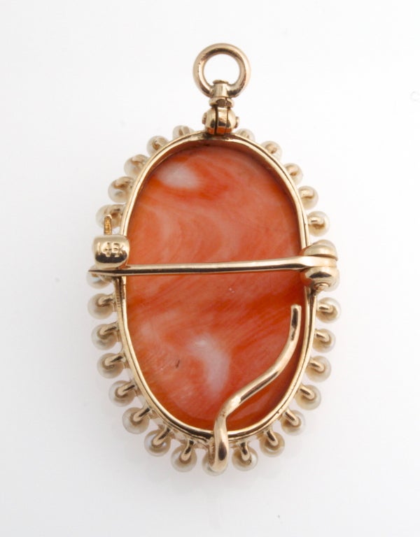 Lovely Victorian coral cameo pin/pendant surrounded by seed pearls in 14kt yellow gold.