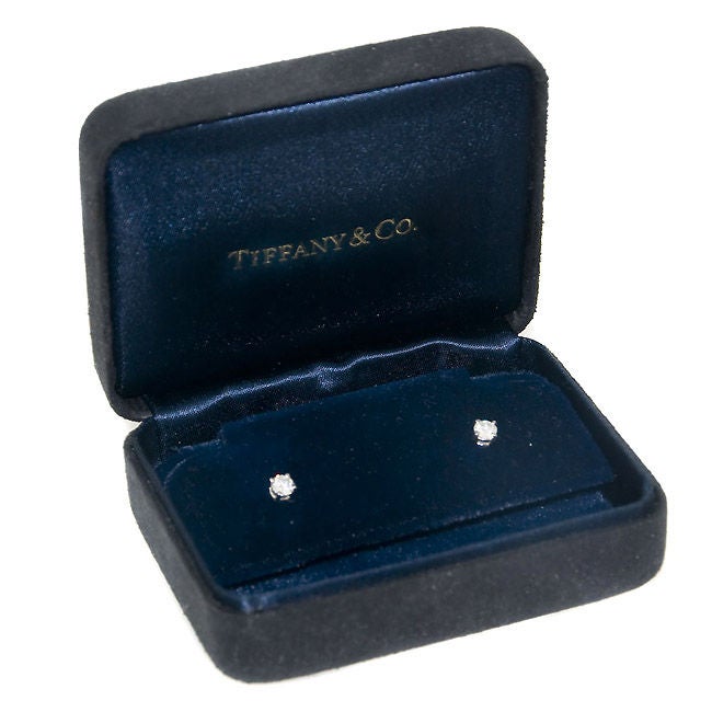 Platinum set, Diamond Stud Earrings by Tiffany & Company, 4 prong heads with Threaded screw back posts. Diamonds equal 1/4 Carat each for a Total of 1/2 Carat and are G in Color and VS in Clarity. Original Box included.