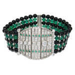 This is a period Art Deco Platinum, Diamond, Emerald, Black and Green onyx Bead Bracelet.The entire bracelet including the center section is flexible and has a great soft feel. Diamonds total 5.50 Carat.