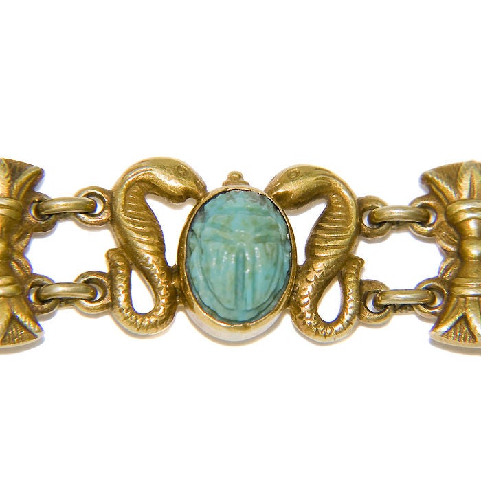 Wonderful Egyptian Revival Bracelet, 14K Yellow gold and set with Turquoise Scarabs, Serphant and Lotus Flower Motifs.