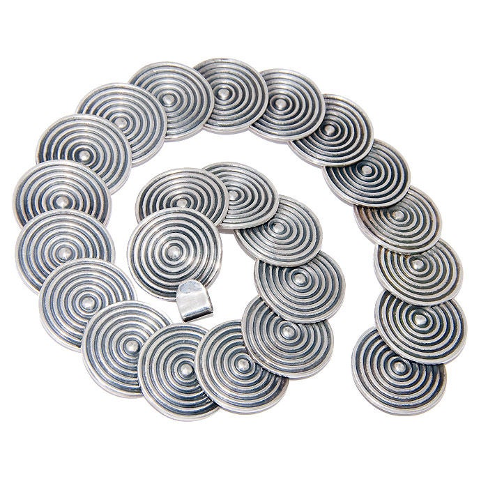 Wonderful Sterling silver Discs Necklace by Los Costillo, Each Disk is rivited to the next to give it free form movement. Signed and Numbered. Each disk measuring 1 Inch in Diameter.